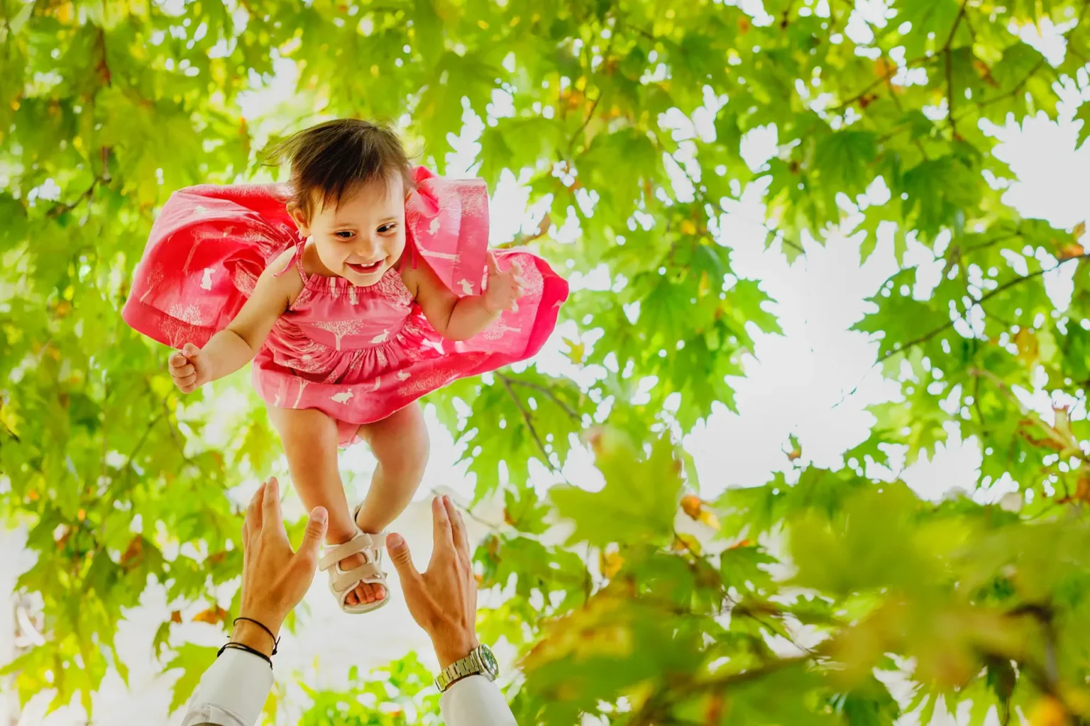 a baby girl in the air