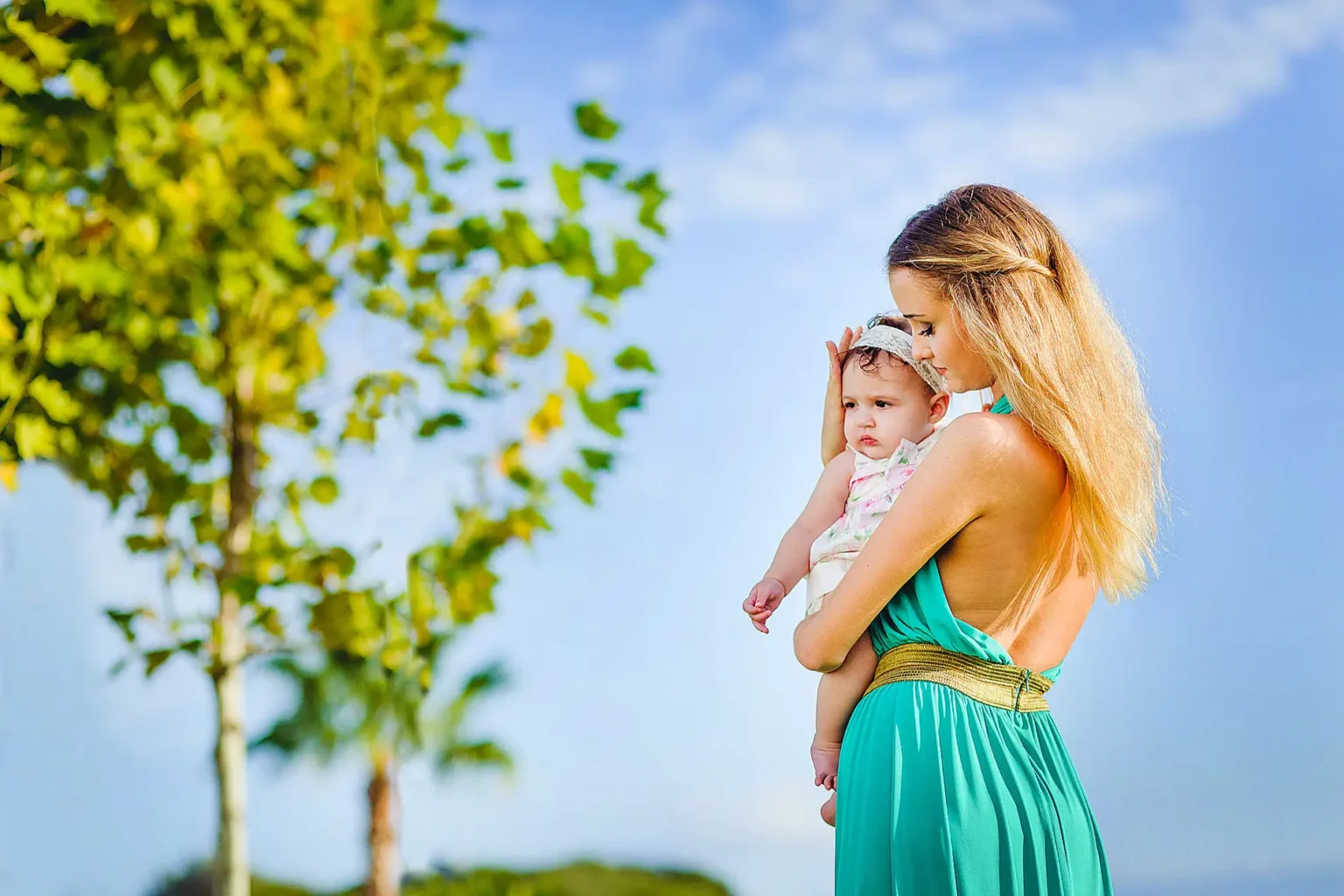 a woman holding a baby