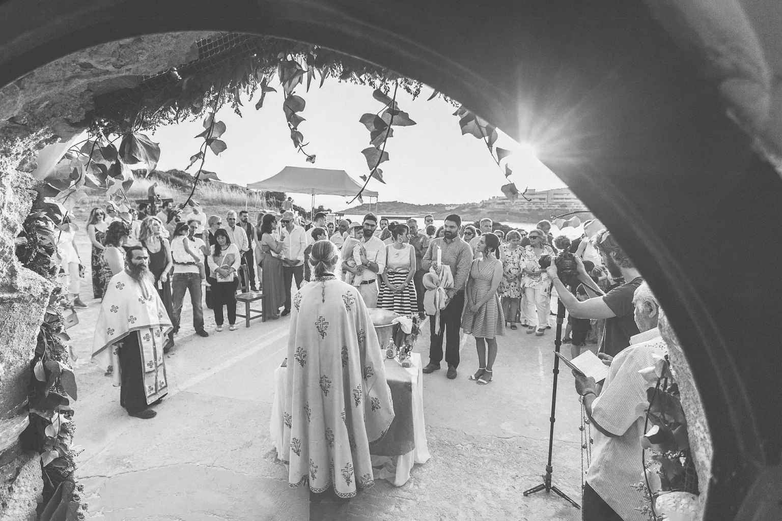a group of people standing under a arch